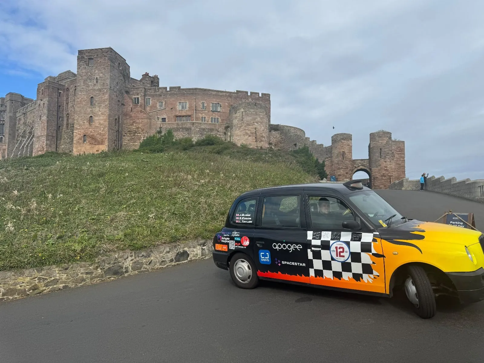 The taxi on the road below Bamburgh Castle