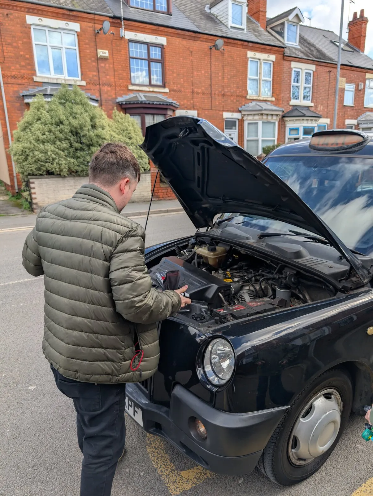 Bonnet up on the taxi on a residential street in Worksop