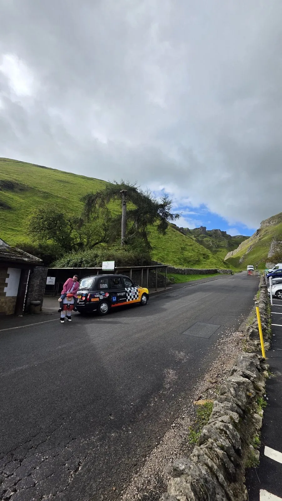The wrapped taxi parked below Winnats Pass in the Peak District